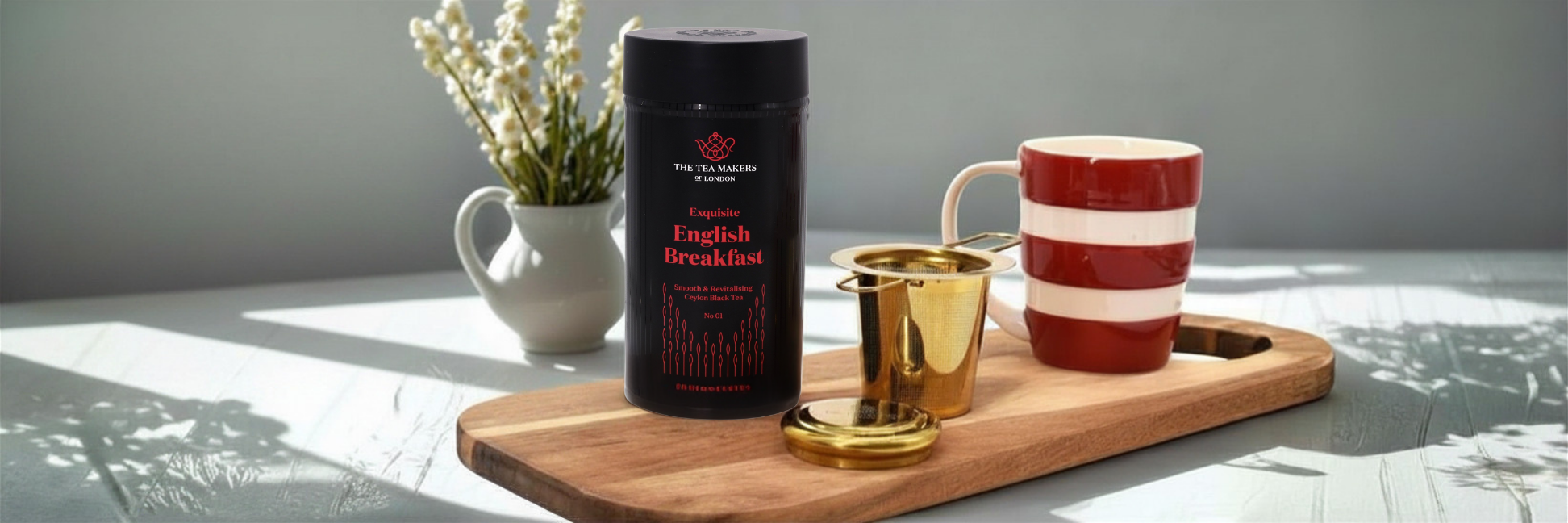 english breakfast tea with tea infuser and mug