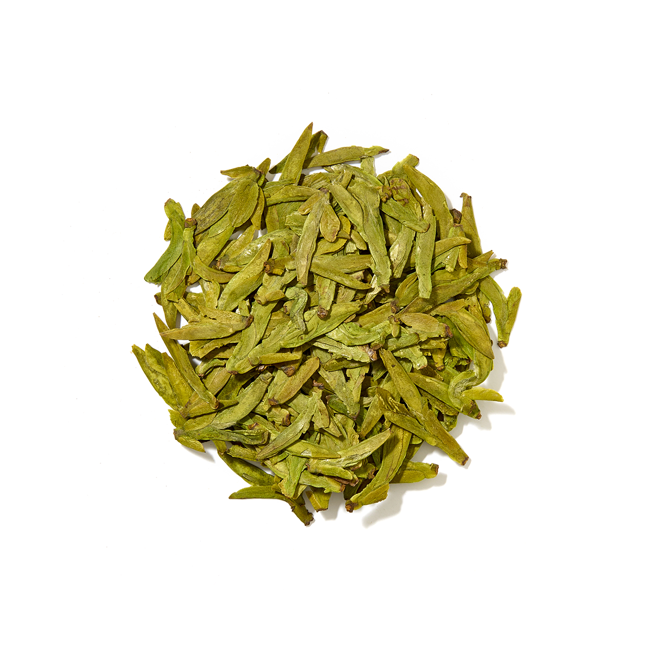Close up of Loose Leaf Green Tea Leaves arranged in a circle 