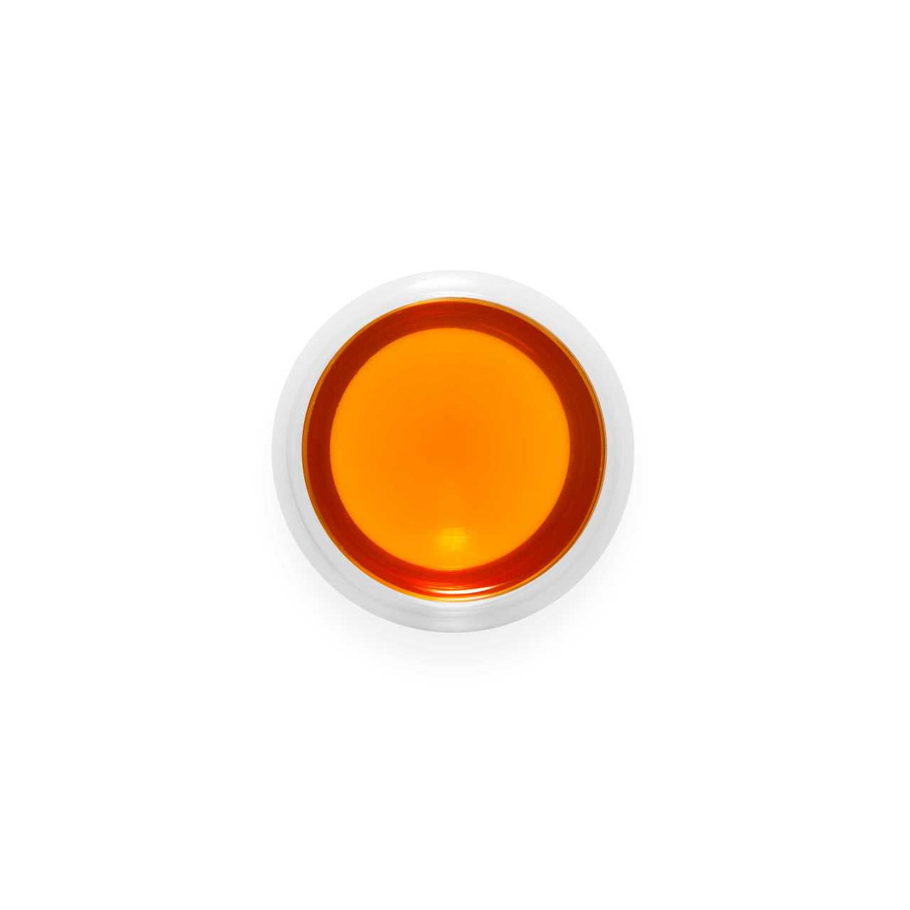 Assam Manjushree Triune Teabag infusion in  a glass cup