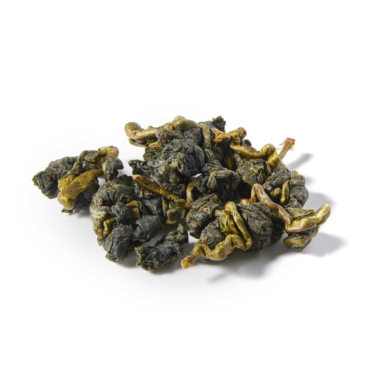 A macro pile of Ali Shan Oolong loose leaf tea on a table