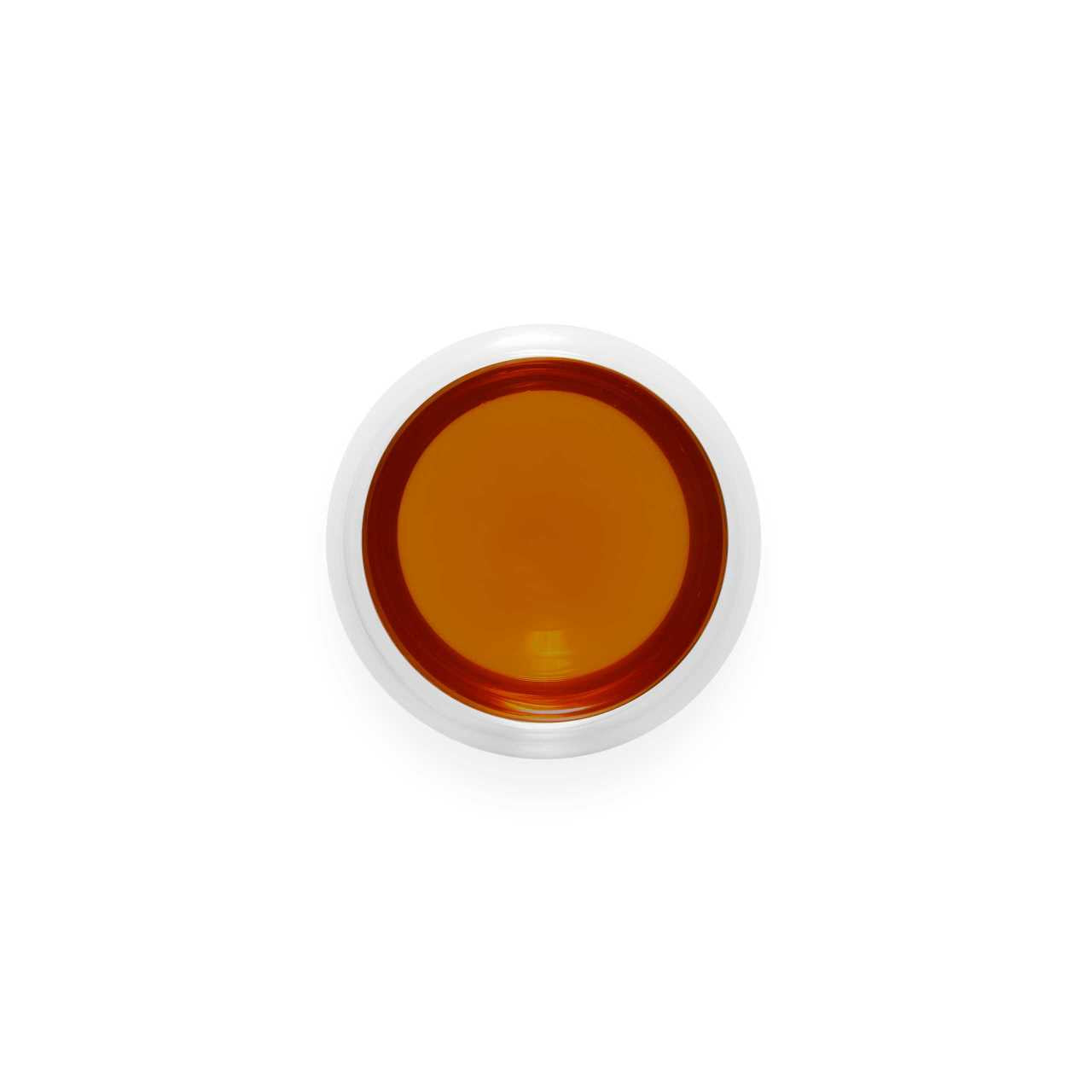 Tangerine Pu-Erh Loose Leaf Tea infusion in a glass cup